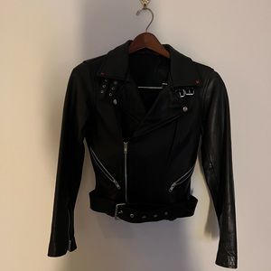 Black leather jacket Asilio in a great condition with a red sign on the back.